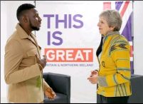 Prime Minister May, delighted to meet  Nigerian who designed her jacket while visiting the country.